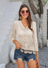 Cárdigan bohemio color albaricoque tejido a crochet con borlas estilo 2024